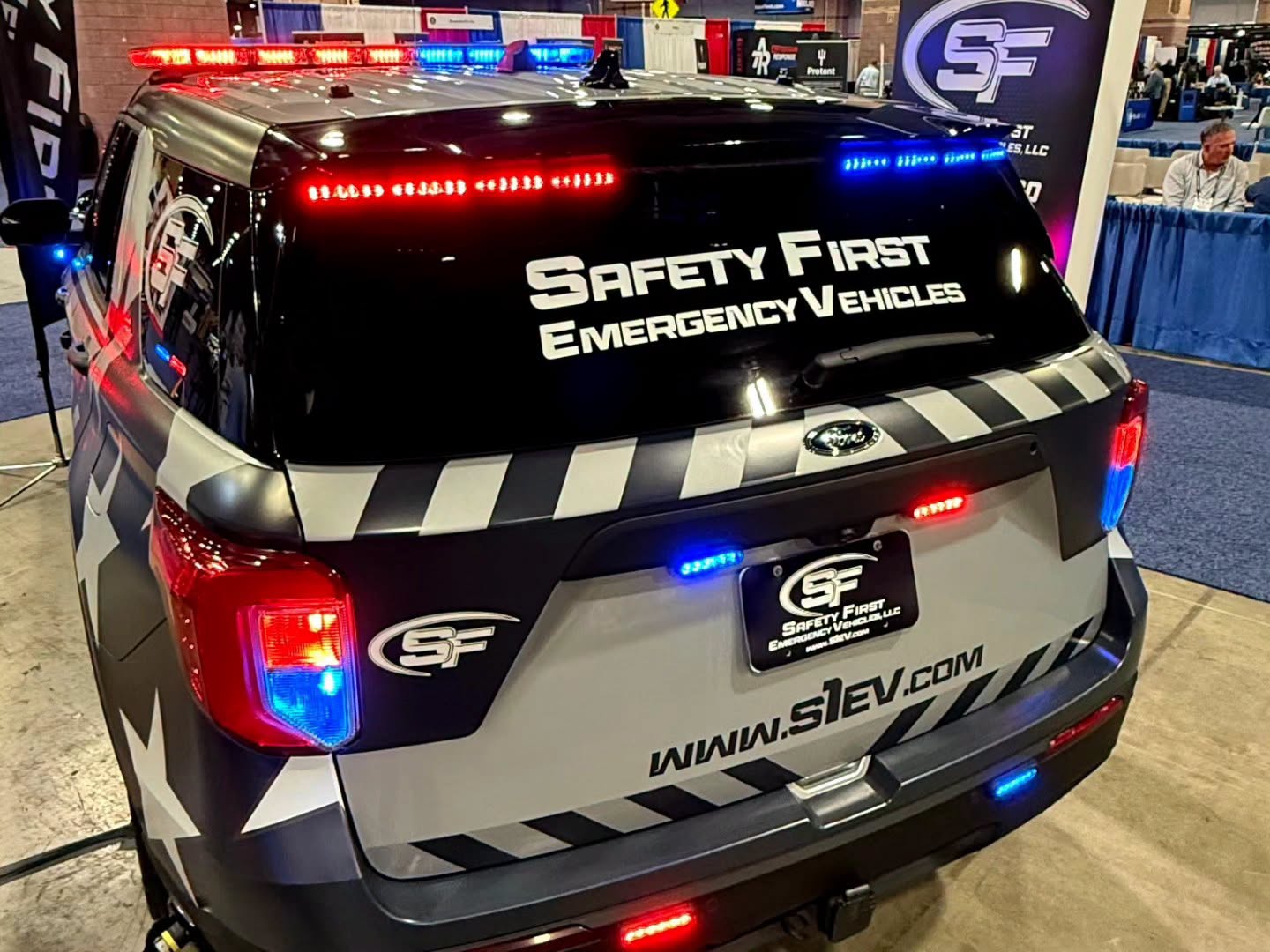 Rear hatch detail of the SafetyFirst Ford Police Interceptor Utility showing the window decal and rear emergency lighting.